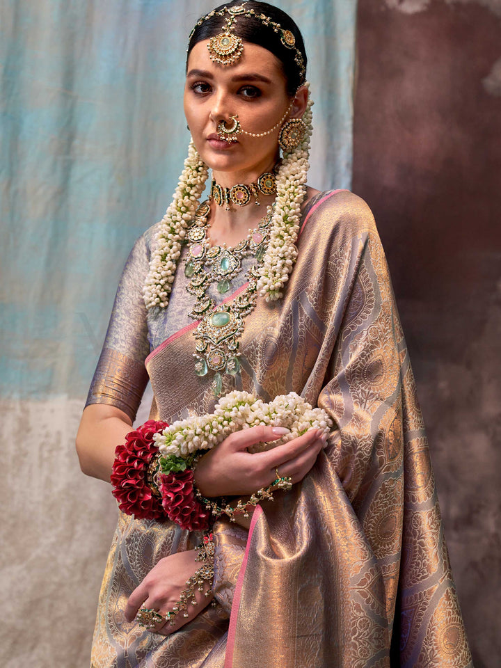 Lavender and Champagne two-tone handwoven silk saree with contrast selvage border and paisley weaving. This image captures the pleats close-up showing symmetry, color blending, and craftsmanship, ideal for visualizing festive elegance, designer appeal, and modern styling inspiration. Perfect for online shoppers seeking detailed previews before purchase, enhancing saree visual merchandising and SEO-rich product display strategy.