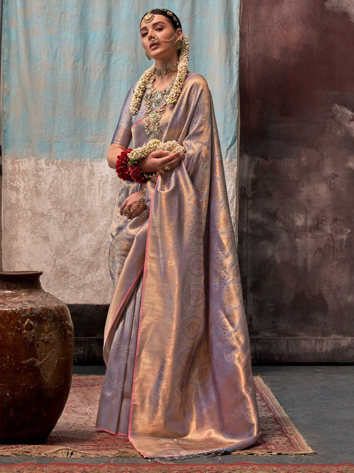 Lavender and Champagne two-tone handwoven silk saree with contrast selvage border and paisley weaving. This image captures the front drape view highlighting pallu fall and pleats alignment, ideal for visualizing festive elegance, designer appeal, and modern styling inspiration. Perfect for online shoppers seeking detailed previews before purchase, enhancing saree visual merchandising and SEO-rich product display strategy.