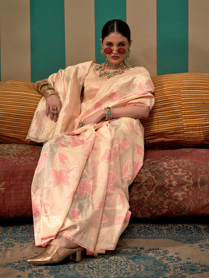 Champagne and Rose Pink linen saree with floral woven motifs and soft handloom texture This image captures the model styling perspective with complete saree ensemble displayed, ideal for visualizing festive elegance, designer appeal, and modern styling inspiration. Perfect for online shoppers seeking detailed previews before purchase, enhancing saree visual merchandising and SEO-rich product display strategy.