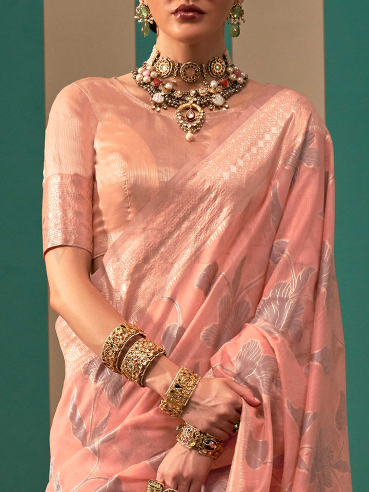Blush Pink and Silver linen saree with floral woven motifs and soft handloom texture This image captures the zoomed texture view illustrating fabric weave and print clarity, ideal for visualizing festive elegance, designer appeal, and modern styling inspiration. Perfect for online shoppers seeking detailed previews before purchase, enhancing saree visual merchandising and SEO-rich product display strategy.
