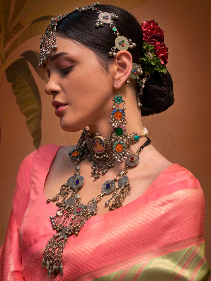 Pista Green and Peach striped silk saree with handloom weave and checked pallu. Ideal for festive season functions like ganesh chaturthi, styled with heritage jewelry and temple-inspired accessories. This image captures the pleats close-up showing symmetry, color blending, and craftsmanship, ideal for visualizing festive elegance, designer appeal, and modern styling inspiration. Perfect for online shoppers seeking detailed previews before purchase, enhancing saree visual merchandising and SEO-rich product d