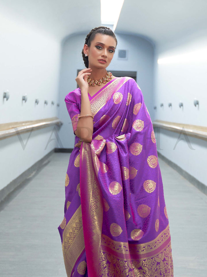 This Royal Purple–Rani Pink Satin Silk saree is crafted with intricate woven zari accents, ideal for receptions, festive wear, and ethnic elegance. A timeless drape with regal charm. SKU 179001. This Royal Purple–Rani Pink Satin Silk saree is crafted with intricate woven zari accents, ideal for receptions, festive wear, and ethnic elegance. A timeless drape with regal charm. SKU 179001.