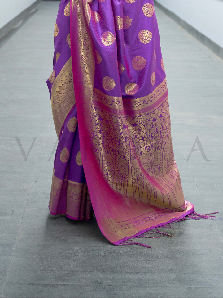 This Royal Purple–Rani Pink Satin Silk saree is crafted with intricate woven zari accents, ideal for receptions, festive wear, and ethnic elegance. A timeless drape with regal charm. SKU 179001. This Royal Purple–Rani Pink Satin Silk saree is crafted with intricate woven zari accents, ideal for receptions, festive wear, and ethnic elegance. A timeless drape with regal charm. SKU 179001.