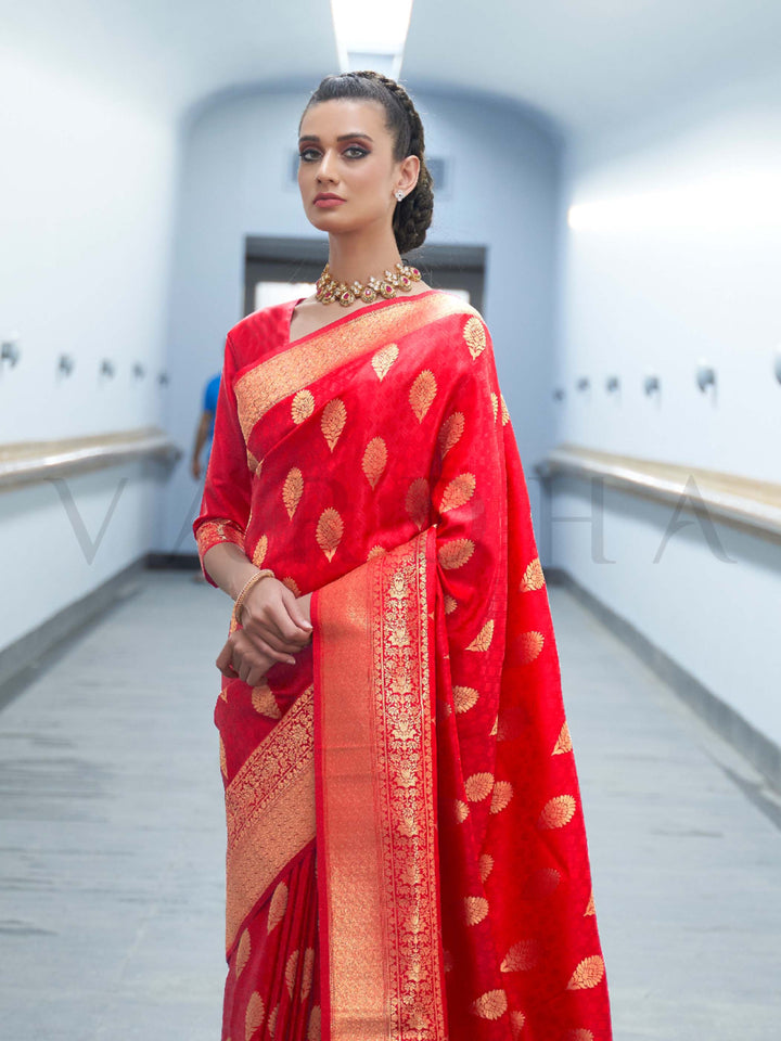 This Vermilion Red–Orange Satin Silk saree is crafted with intricate woven zari accents, ideal for receptions, festive wear, and ethnic elegance. A timeless drape with regal charm. SKU 179004. This Vermilion Red–Orange Satin Silk saree is crafted with intricate woven zari accents, ideal for receptions, festive wear, and ethnic elegance. A timeless drape with regal charm. SKU 179004.