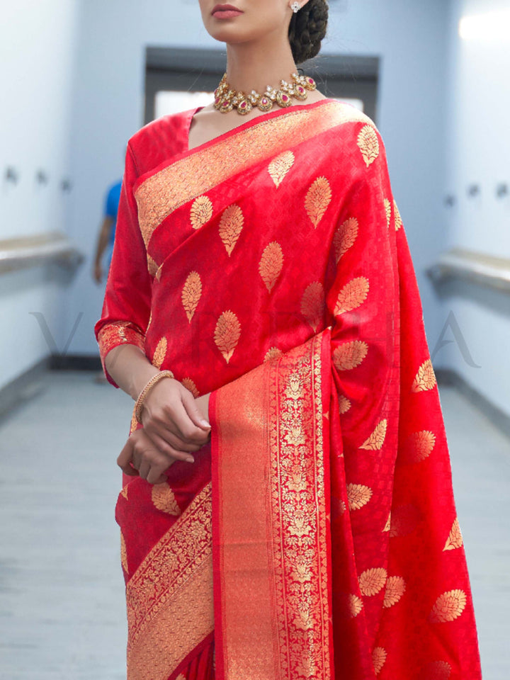 This Vermilion Red–Orange Satin Silk saree is crafted with intricate woven zari accents, ideal for receptions, festive wear, and ethnic elegance. A timeless drape with regal charm. SKU 179004. This Vermilion Red–Orange Satin Silk saree is crafted with intricate woven zari accents, ideal for receptions, festive wear, and ethnic elegance. A timeless drape with regal charm. SKU 179004.