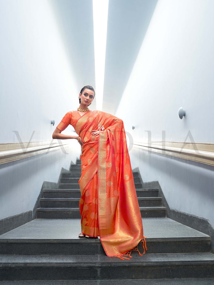 This Orange–Gold Satin Silk saree is crafted with intricate woven zari accents, ideal for receptions, festive wear, and ethnic elegance. A timeless drape with regal charm. SKU 179006. This Orange–Gold Satin Silk saree is crafted with intricate woven zari accents, ideal for receptions, festive wear, and ethnic elegance. A timeless drape with regal charm. SKU 179006.