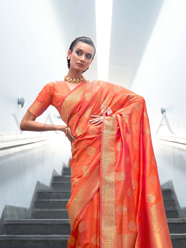 This Orange–Gold Satin Silk saree is crafted with intricate woven zari accents, ideal for receptions, festive wear, and ethnic elegance. A timeless drape with regal charm. SKU 179006. This Orange–Gold Satin Silk saree is crafted with intricate woven zari accents, ideal for receptions, festive wear, and ethnic elegance. A timeless drape with regal charm. SKU 179006.