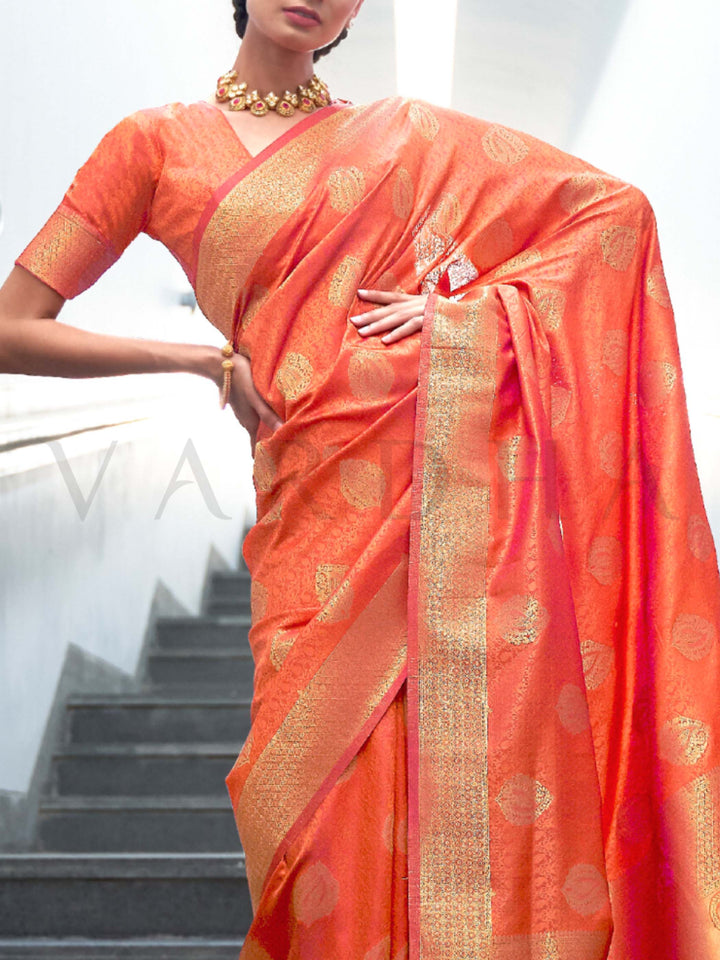This Orange–Gold Satin Silk saree is crafted with intricate woven zari accents, ideal for receptions, festive wear, and ethnic elegance. A timeless drape with regal charm. SKU 179006. This Orange–Gold Satin Silk saree is crafted with intricate woven zari accents, ideal for receptions, festive wear, and ethnic elegance. A timeless drape with regal charm. SKU 179006.