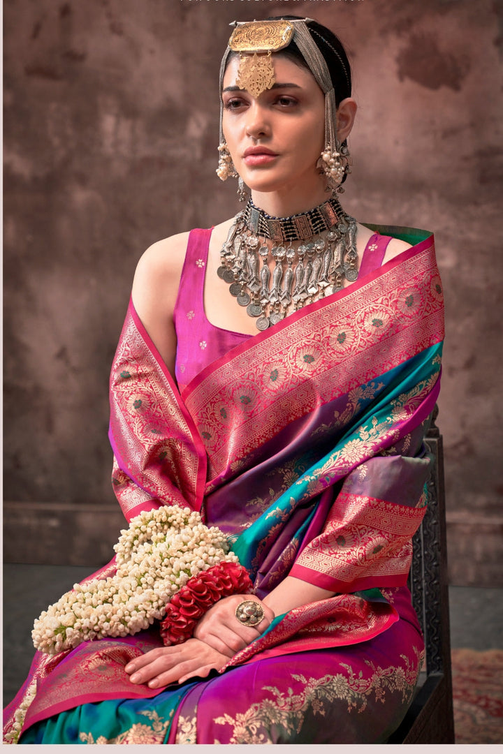 Fuchsia and Teal Blue Rangkaat silk saree with temple borders, intricate zari pallu, and traditional wedding styling. Handloom drape perfect for bollywood functions and magazine shoot, styled with mogra, antique jewelry, and regal stance. This image captures the zoomed texture view illustrating fabric weave and print clarity, ideal for visualizing festive elegance, designer appeal, and modern styling inspiration. Perfect for online shoppers seeking detailed previews before purchase, enhancing saree visual m