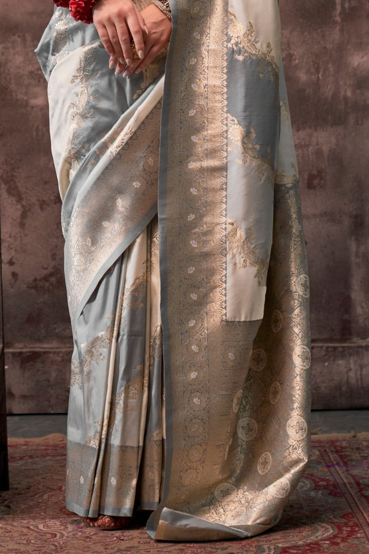 Pearl Grey and Ivory Rangkaat silk saree with temple borders, intricate zari pallu, and traditional wedding styling. Handloom drape perfect for party-wear functions and reception or gala, styled with mogra, antique jewelry, and regal stance. This image captures the side angle view showcasing blouse styling and zari border detail, ideal for visualizing festive elegance, designer appeal, and modern styling inspiration. Perfect for online shoppers seeking detailed previews before purchase, enhancing saree visu