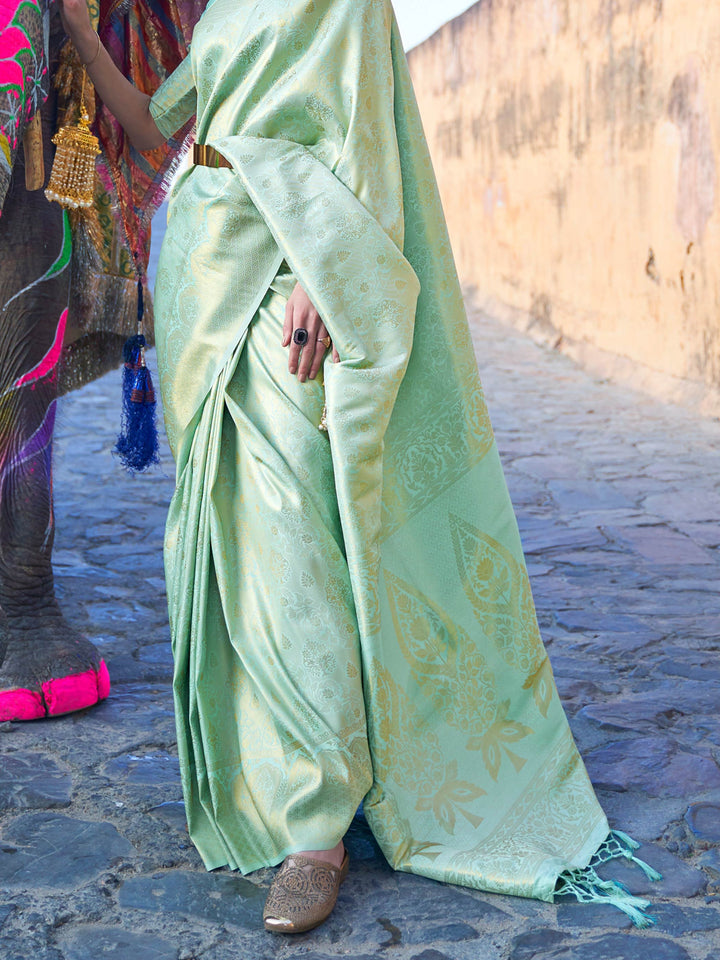 Traditional silk weave with gold accents across Sea Green–Gold body and pallu. Elegant Sea Green–Gold saree in kanjivaram silk for poojas and family celebrations.
