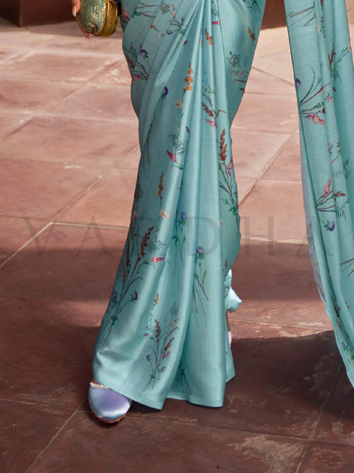 This Ice Blue–Multi Satin Crepe saree showcases stunning digital floral print that enhances its party-ready drape. Digitally crafted floral elegance for day-to-night ethnic wear. SKU 260006. This Ice Blue–Multi Satin Crepe saree showcases stunning digital floral print that enhances its party-ready drape. Digitally crafted floral elegance for day-to-night ethnic wear. SKU 260006.