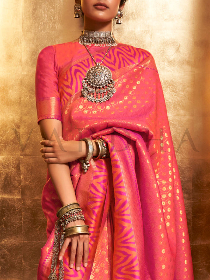 This luxurious Coral Peach–Rose Pink Kanjivaram Silk saree features classic woven zari work with contrast pallu and ornate detailing. Elegant wedding attire with heritage style and timeless drape. SKU 271007. This luxurious Coral Peach–Rose Pink Kanjivaram Silk saree features classic woven zari work with contrast pallu and ornate detailing. Elegant wedding attire with heritage style and timeless drape. SKU 271007.