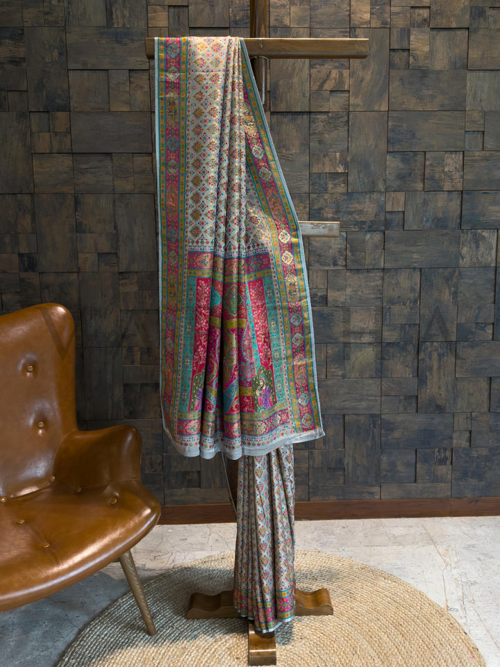 Traditional patterned fabric draped over a wooden stand against a textured wall.