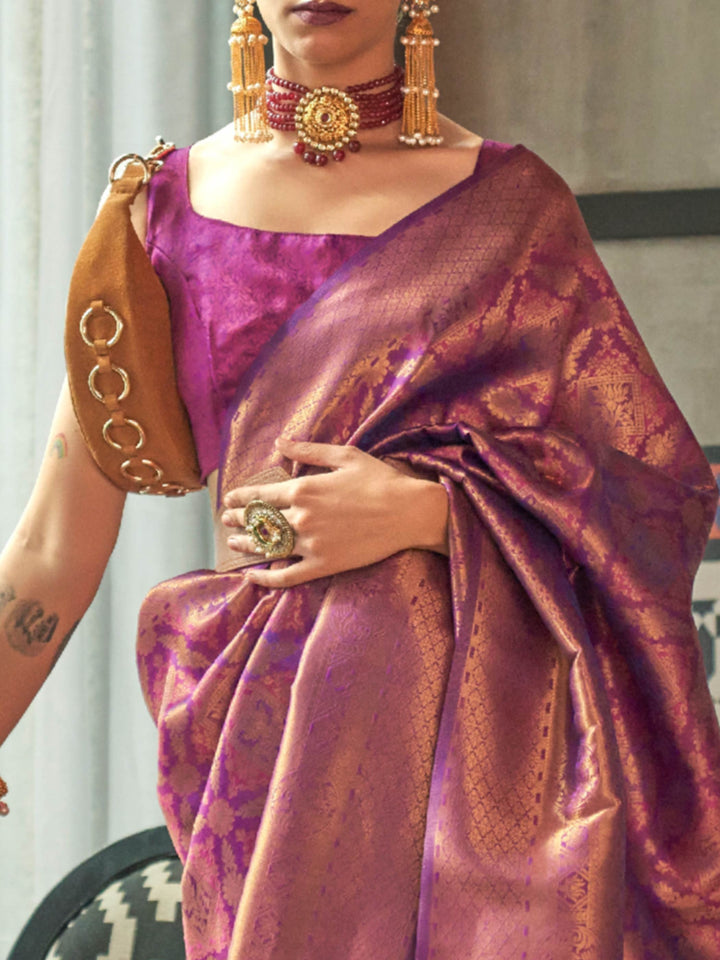 Royal kanjivaram silk saree in Purple–Rose Gold with traditional motifs and contrast blouse. Purple–Rose Gold wedding kanjivaram silk with soft zari sheen, heritage vibe, and jacquard elegance.