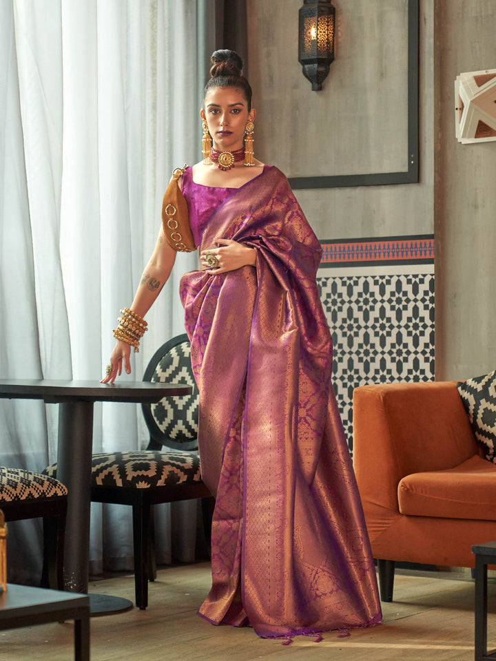 Purple–Rose Gold kanjivaram silk saree with traditional zari motifs and bridal styling for grand events. Two-tone wedding saree in Purple–Rose Gold with jacquard pallu and festive bridal drape.