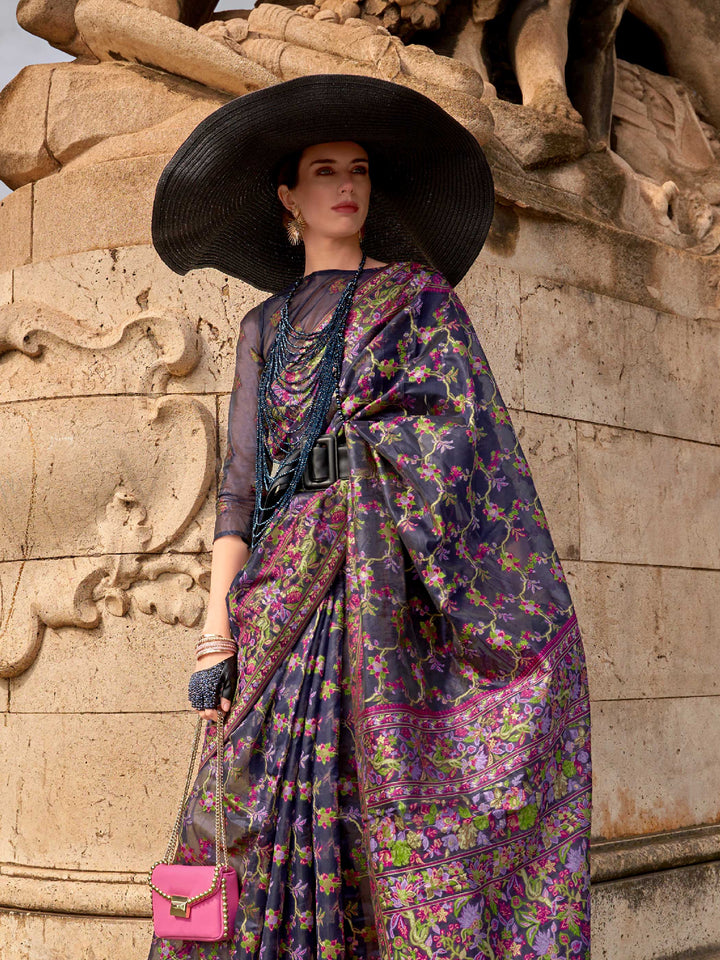 Midnight Navy organza parsi silk saree with intricate multicolor thread floral embroidery and handloom craftsmanship, ideal for bollywood and styled perfectly for premiere night elegance and fashion-forward flair. This image captures the side angle view showcasing blouse styling and zari border detail, ideal for visualizing festive elegance, designer appeal, and modern styling inspiration. Perfect for online shoppers seeking detailed previews before purchase, enhancing saree visual merchandising and SEO-ric