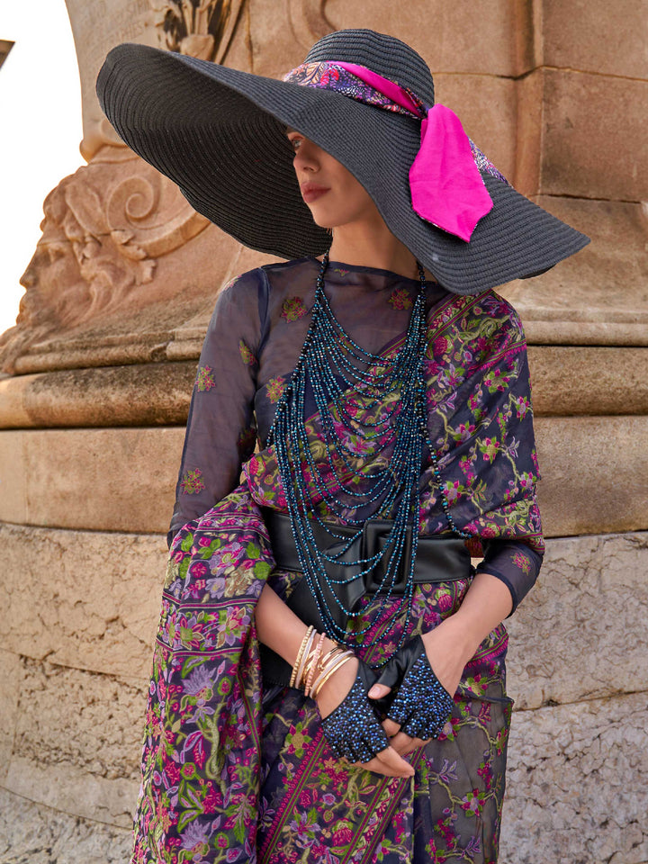 Midnight Navy organza parsi silk saree with intricate multicolor thread floral embroidery and handloom craftsmanship, ideal for bollywood and styled perfectly for premiere night elegance and fashion-forward flair. This image captures the model styling perspective with complete saree ensemble displayed, ideal for visualizing festive elegance, designer appeal, and modern styling inspiration. Perfect for online shoppers seeking detailed previews before purchase, enhancing saree visual merchandising and SEO-ric