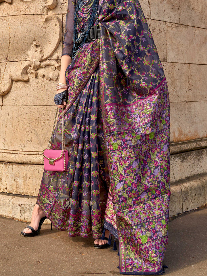 Midnight Navy organza parsi silk saree with intricate multicolor thread floral embroidery and handloom craftsmanship, ideal for bollywood and styled perfectly for premiere night elegance and fashion-forward flair. This image captures the back drape focus revealing pallu finesse and motif richness, ideal for visualizing festive elegance, designer appeal, and modern styling inspiration. Perfect for online shoppers seeking detailed previews before purchase, enhancing saree visual merchandising and SEO-rich pro