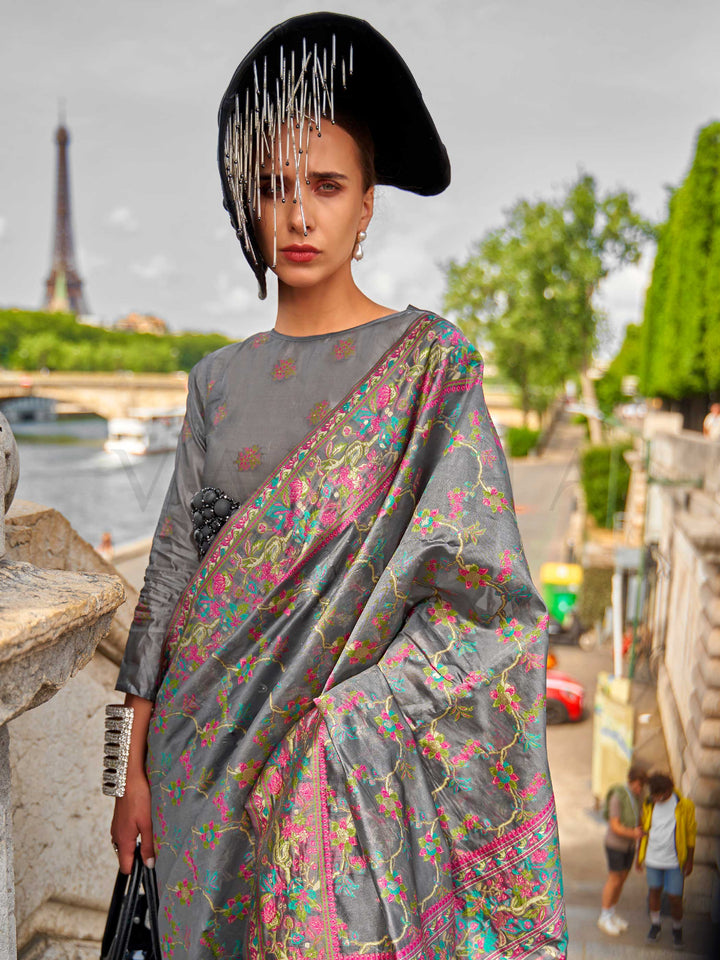 Charcoal Grey organza parsi silk saree with intricate multicolor thread floral embroidery and handloom craftsmanship, ideal for festive season and styled perfectly for diwali celebration elegance and fashion-forward flair. This image captures the model styling perspective with complete saree ensemble displayed, ideal for visualizing festive elegance, designer appeal, and modern styling inspiration. Perfect for online shoppers seeking detailed previews before purchase, enhancing saree visual merchandising an