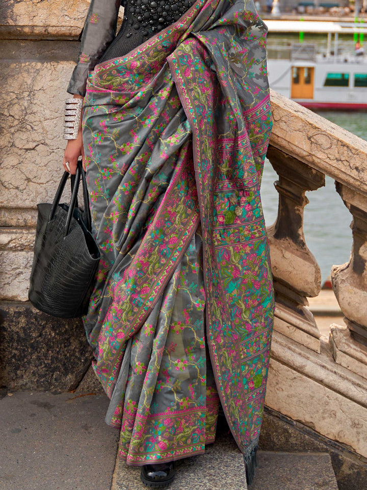 Charcoal Grey organza parsi silk saree with intricate multicolor thread floral embroidery and handloom craftsmanship, ideal for festive season and styled perfectly for diwali celebration elegance and fashion-forward flair. This image captures the back drape focus revealing pallu finesse and motif richness, ideal for visualizing festive elegance, designer appeal, and modern styling inspiration. Perfect for online shoppers seeking detailed previews before purchase, enhancing saree visual merchandising and SEO