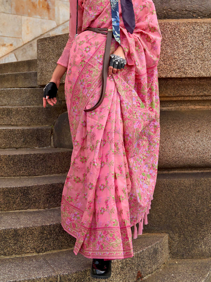 Rose Pink organza parsi silk saree with intricate multicolor thread floral embroidery and handloom craftsmanship, ideal for festive season and styled perfectly for haldi glow elegance and fashion-forward flair. This image captures the back drape focus revealing pallu finesse and motif richness, ideal for visualizing festive elegance, designer appeal, and modern styling inspiration. Perfect for online shoppers seeking detailed previews before purchase, enhancing saree visual merchandising and SEO-rich produc