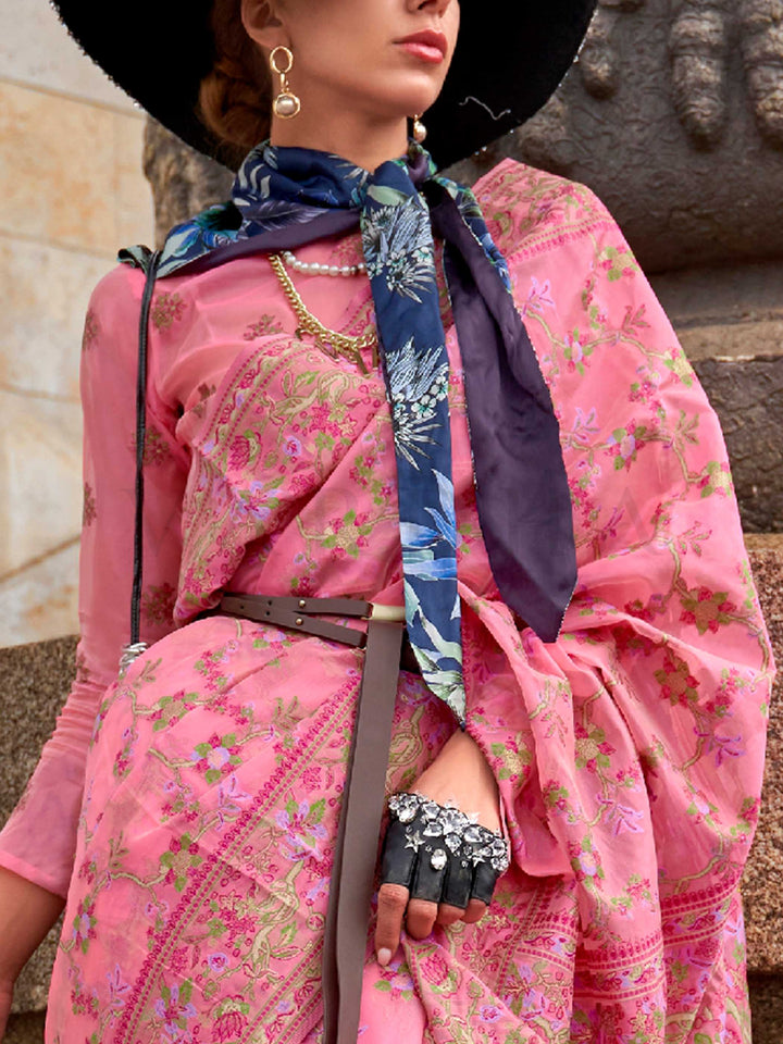 Rose Pink organza parsi silk saree with intricate multicolor thread floral embroidery and handloom craftsmanship, ideal for festive season and styled perfectly for haldi glow elegance and fashion-forward flair. This image captures the zoomed texture view illustrating fabric weave and print clarity, ideal for visualizing festive elegance, designer appeal, and modern styling inspiration. Perfect for online shoppers seeking detailed previews before purchase, enhancing saree visual merchandising and SEO-rich pr