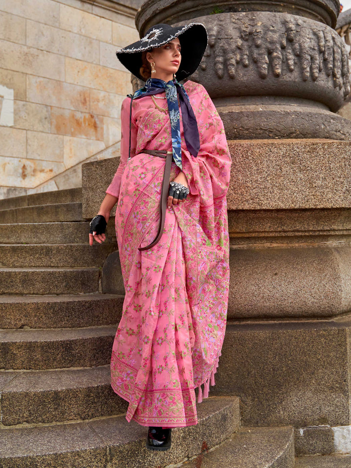 Rose Pink organza parsi silk saree with intricate multicolor thread floral embroidery and handloom craftsmanship, ideal for festive season and styled perfectly for haldi glow elegance and fashion-forward flair. This image captures the front drape view highlighting pallu fall and pleats alignment, ideal for visualizing festive elegance, designer appeal, and modern styling inspiration. Perfect for online shoppers seeking detailed previews before purchase, enhancing saree visual merchandising and SEO-rich prod