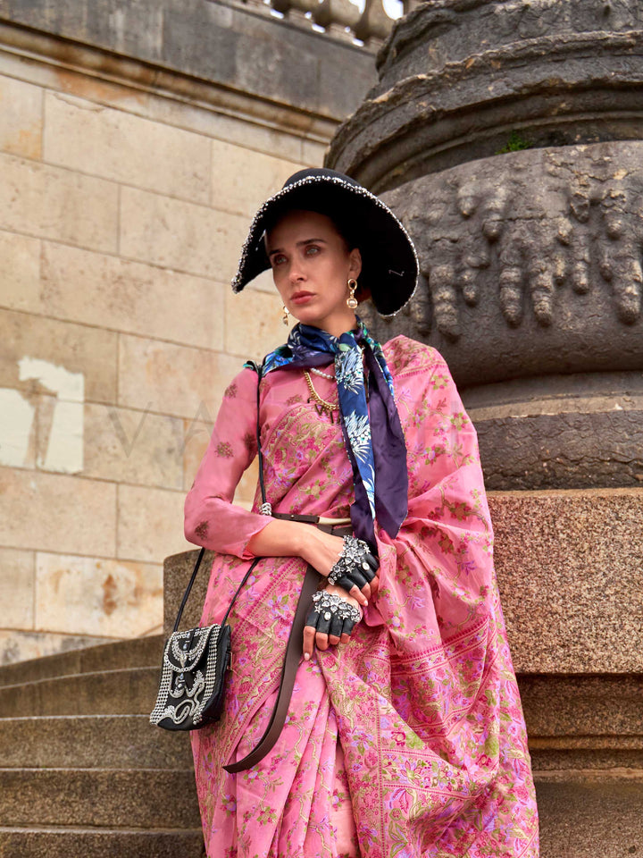 Rose Pink organza parsi silk saree with intricate multicolor thread floral embroidery and handloom craftsmanship, ideal for festive season and styled perfectly for haldi glow elegance and fashion-forward flair. This image captures the model styling perspective with complete saree ensemble displayed, ideal for visualizing festive elegance, designer appeal, and modern styling inspiration. Perfect for online shoppers seeking detailed previews before purchase, enhancing saree visual merchandising and SEO-rich p