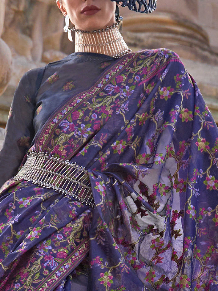 Royal Violet organza parsi silk saree with intricate multicolor thread floral embroidery and handloom craftsmanship, ideal for bollywood and styled perfectly for ramp walk look elegance and fashion-forward flair. This image captures the zoomed texture view illustrating fabric weave and print clarity, ideal for visualizing festive elegance, designer appeal, and modern styling inspiration. Perfect for online shoppers seeking detailed previews before purchase, enhancing saree visual merchandising and SEO-rich