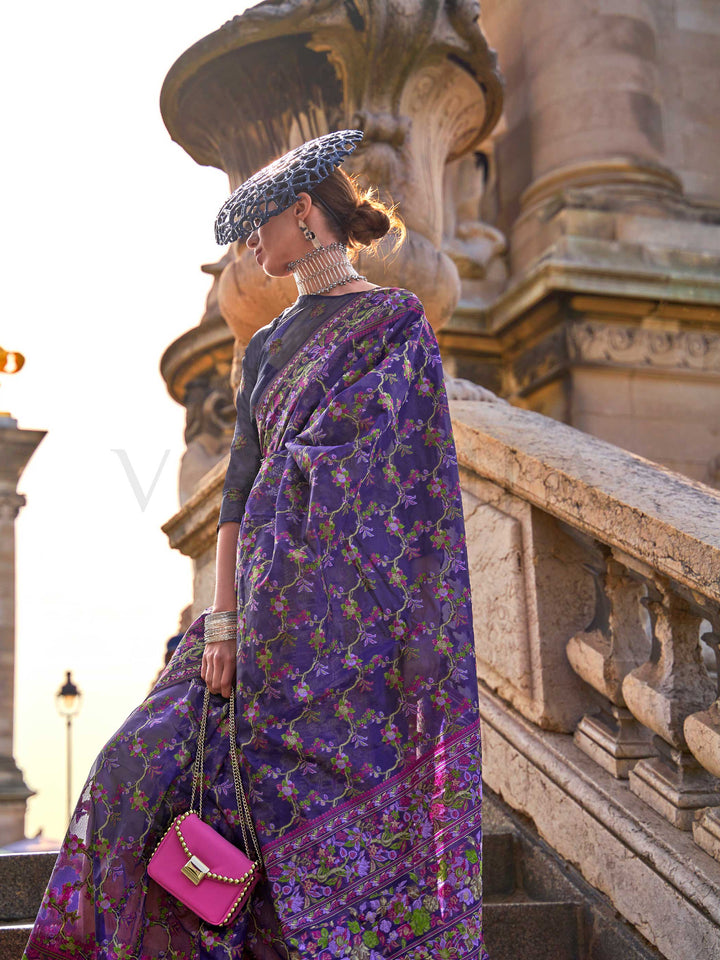 Royal Violet organza parsi silk saree with intricate multicolor thread floral embroidery and handloom craftsmanship, ideal for bollywood and styled perfectly for ramp walk look elegance and fashion-forward flair. This image captures the front drape view highlighting pallu fall and pleats alignment, ideal for visualizing festive elegance, designer appeal, and modern styling inspiration. Perfect for online shoppers seeking detailed previews before purchase, enhancing saree visual merchandising and SEO-rich pr