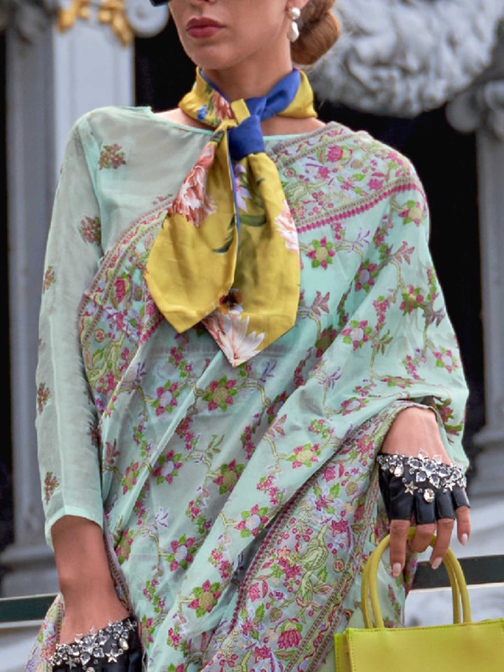 Seafoam Mint organza parsi silk saree with intricate multicolor thread floral embroidery and handloom craftsmanship, ideal for party-wear and styled perfectly for garden function elegance and fashion-forward flair. This image captures the zoomed texture view illustrating fabric weave and print clarity, ideal for visualizing festive elegance, designer appeal, and modern styling inspiration. Perfect for online shoppers seeking detailed previews before purchase, enhancing saree visual merchandising and SEO-ric