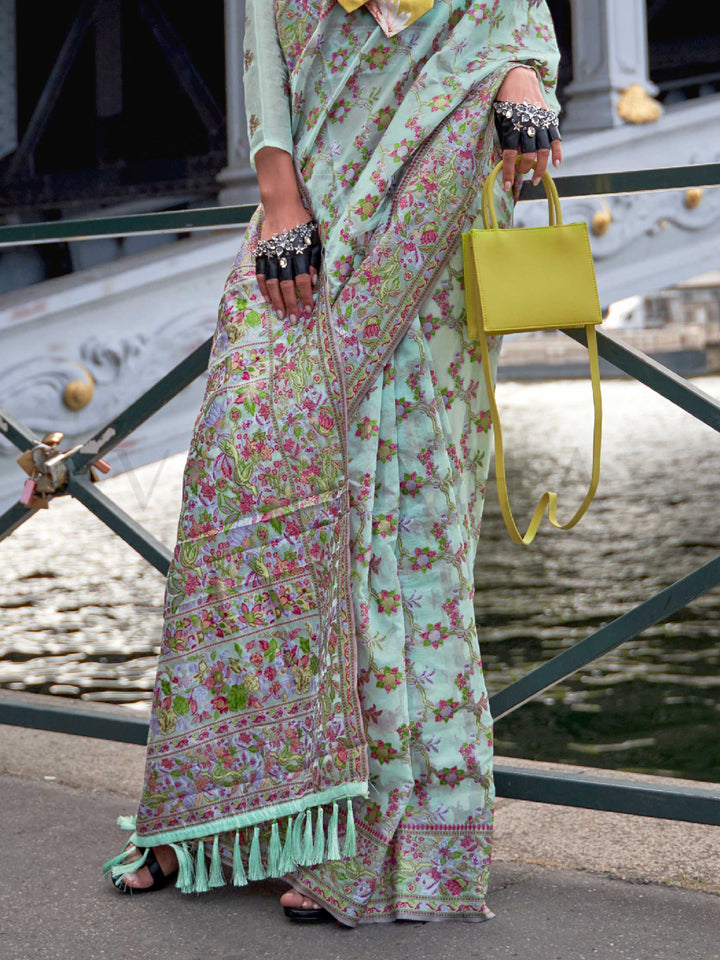 Seafoam Mint organza parsi silk saree with intricate multicolor thread floral embroidery and handloom craftsmanship, ideal for party-wear and styled perfectly for garden function elegance and fashion-forward flair. This image captures the back drape focus revealing pallu finesse and motif richness, ideal for visualizing festive elegance, designer appeal, and modern styling inspiration. Perfect for online shoppers seeking detailed previews before purchase, enhancing saree visual merchandising and SEO-rich pr