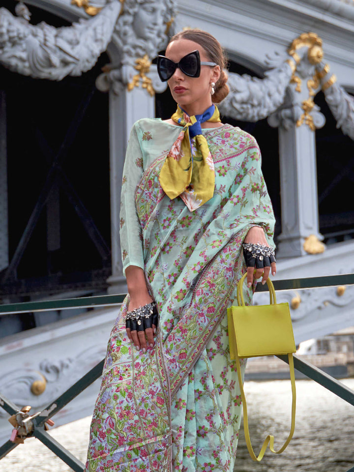 Seafoam Mint organza parsi silk saree with intricate multicolor thread floral embroidery and handloom craftsmanship, ideal for party-wear and styled perfectly for garden function elegance and fashion-forward flair. This image captures the side angle view showcasing blouse styling and zari border detail, ideal for visualizing festive elegance, designer appeal, and modern styling inspiration. Perfect for online shoppers seeking detailed previews before purchase, enhancing saree visual merchandising and SEO-ri