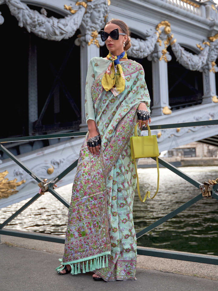 Seafoam Mint organza parsi silk saree with intricate multicolor thread floral embroidery and handloom craftsmanship, ideal for party-wear and styled perfectly for garden function elegance and fashion-forward flair. This image captures the front drape view highlighting pallu fall and pleats alignment, ideal for visualizing festive elegance, designer appeal, and modern styling inspiration. Perfect for online shoppers seeking detailed previews before purchase, enhancing saree visual merchandising and SEO-rich