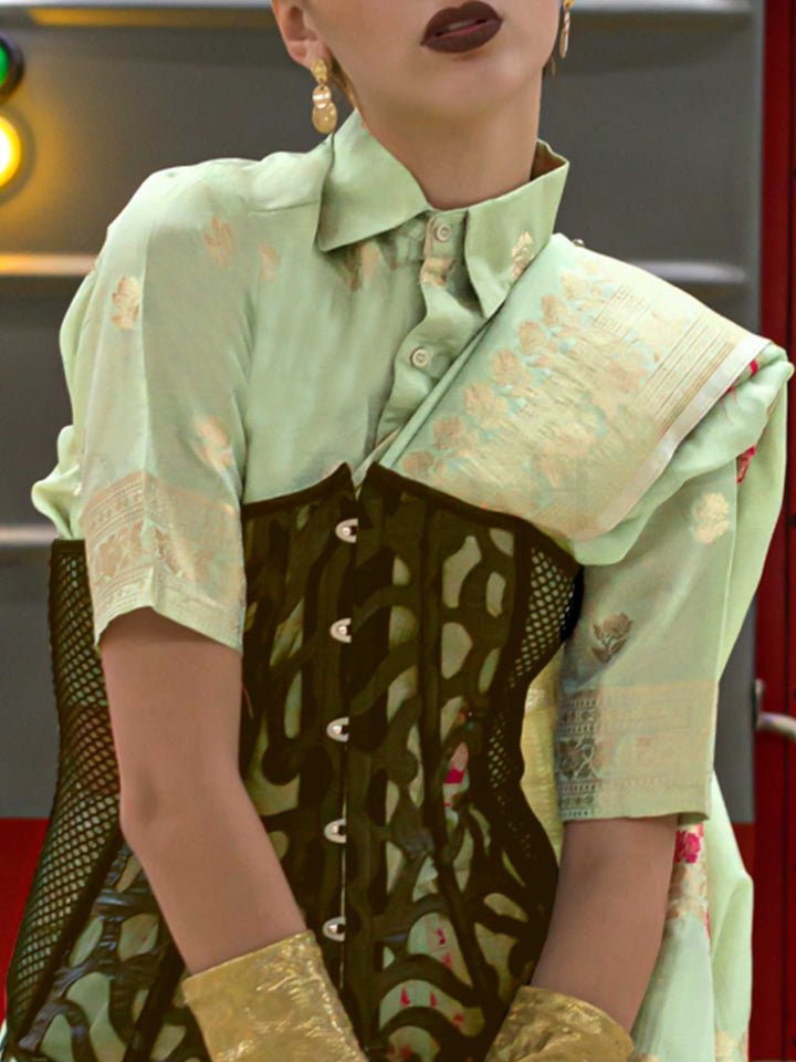 Mint Green silk saree with Beige Zari zari and Peach Blossom floral motifs, styled with contrast blouse, handloom weaving, festive-ready look with cinematic silhouette and bold accessories — ideal for events and grand celebrations. This image captures the zoomed texture view illustrating fabric weave and print clarity, ideal for visualizing festive elegance, designer appeal, and modern styling inspiration. Perfect for online shoppers seeking detailed previews before purchase, enhancing saree visual merchand