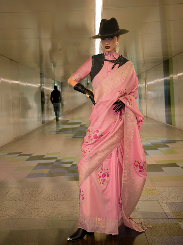 Pastel Pink silk saree with Champagne Zari zari and Magenta floral motifs, styled with contrast blouse, handloom weaving, festive-ready look with cinematic silhouette and bold accessories — ideal for events and grand celebrations. This image captures the front drape view highlighting pallu fall and pleats alignment, ideal for visualizing festive elegance, designer appeal, and modern styling inspiration. Perfect for online shoppers seeking detailed previews before purchase, enhancing saree visual merchandisi