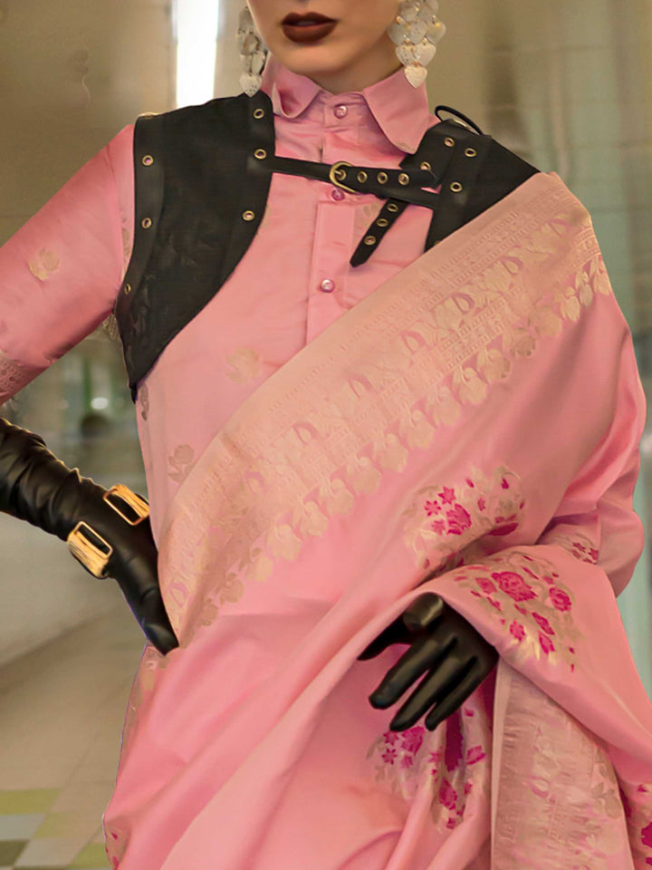 Pastel Pink silk saree with Champagne Zari zari and Magenta floral motifs, styled with contrast blouse, handloom weaving, festive-ready look with cinematic silhouette and bold accessories — ideal for events and grand celebrations. This image captures the zoomed texture view illustrating fabric weave and print clarity, ideal for visualizing festive elegance, designer appeal, and modern styling inspiration. Perfect for online shoppers seeking detailed previews before purchase, enhancing saree visual merchandi