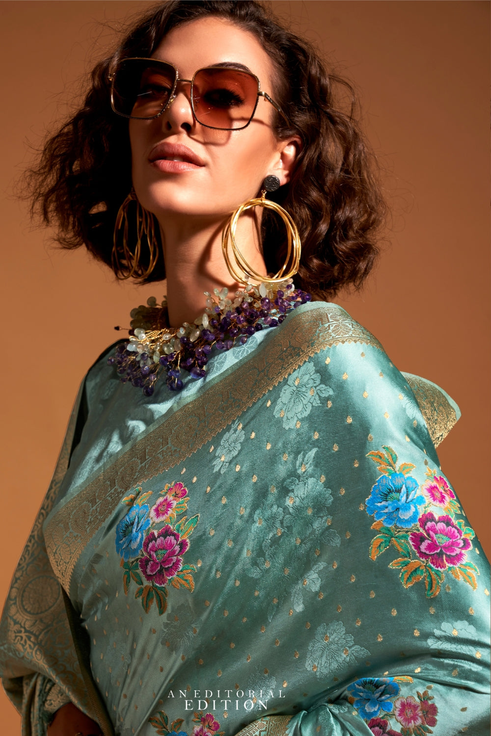 Mint Blue pure satin silk saree with multicolour floral handloom weaving and rich zari border. Styled for festive season and perfect for raksha bandhan, blending regal silk elegance with festive florals. This image captures the back drape focus revealing pallu finesse and motif richness, ideal for visualizing festive elegance, designer appeal, and modern styling inspiration. Perfect for online shoppers seeking detailed previews before purchase, enhancing saree visual merchandising and SEO-rich product displ