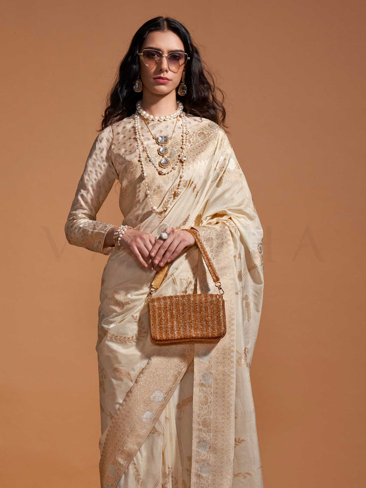The saree is woven from high-grade pure georgette with intricate zari embroidery across the body in traditional floral motifs