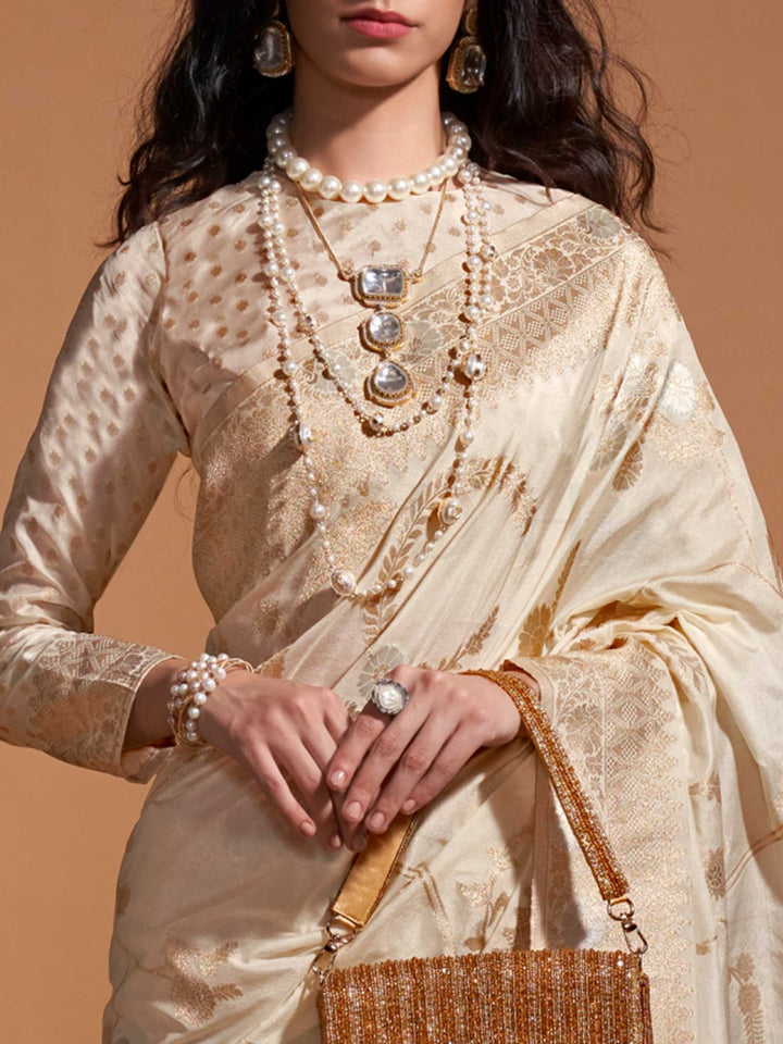 The soft, sheer fall of georgette is visible as it cascades over the shoulder in a natural pleated arrangement, highlighting its lightness and fluidity