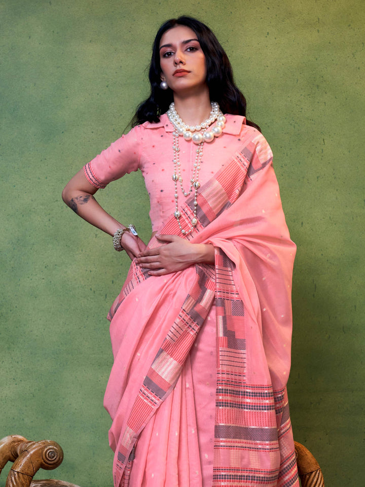 Blush Pink–Grey festive saree featuring woven checks, tassel finish, and soft pastel elegance. Pastel Blush Pink–Grey cotton saree for cultural daywear with minimalistic woven detailing.