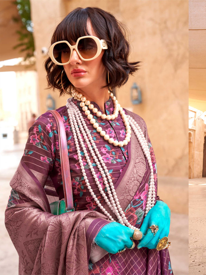 This Plum Purple–Dusty Rose FeatherSoft saree features stunning printed floral work with floral detailing and grid textures, ideal for festive evenings and cocktail-ready styling. Designed for lightweight elegance and statement draping. SKU 376001. This Plum Purple–Dusty Rose FeatherSoft saree features stunning printed floral work with floral detailing and grid textures, ideal for festive evenings and cocktail-ready styling. Designed for lightweight elegance and statement draping. SKU 376001.