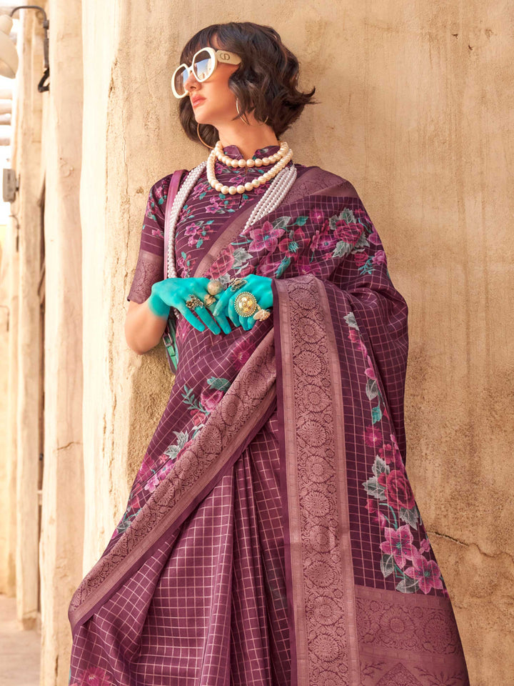 This Plum Purple–Dusty Rose FeatherSoft saree features stunning printed floral work with floral detailing and grid textures, ideal for festive evenings and cocktail-ready styling. Designed for lightweight elegance and statement draping. SKU 376001. This Plum Purple–Dusty Rose FeatherSoft saree features stunning printed floral work with floral detailing and grid textures, ideal for festive evenings and cocktail-ready styling. Designed for lightweight elegance and statement draping. SKU 376001.