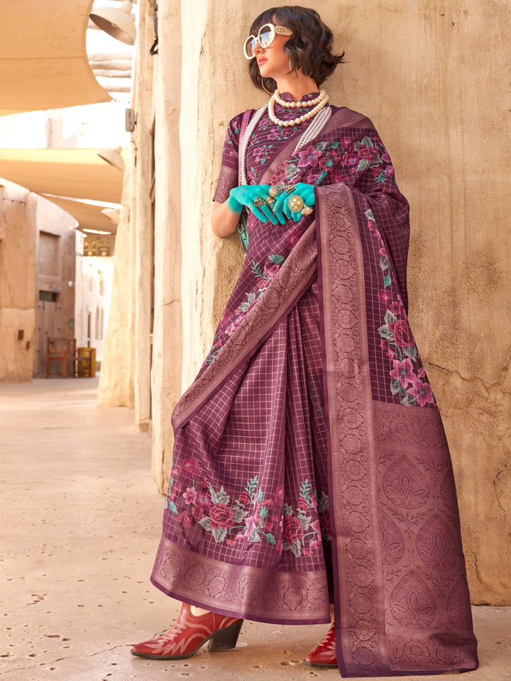 This Plum Purple–Dusty Rose FeatherSoft saree features stunning printed floral work with floral detailing and grid textures, ideal for festive evenings and cocktail-ready styling. Designed for lightweight elegance and statement draping. SKU 376001. This Plum Purple–Dusty Rose FeatherSoft saree features stunning printed floral work with floral detailing and grid textures, ideal for festive evenings and cocktail-ready styling. Designed for lightweight elegance and statement draping. SKU 376001.