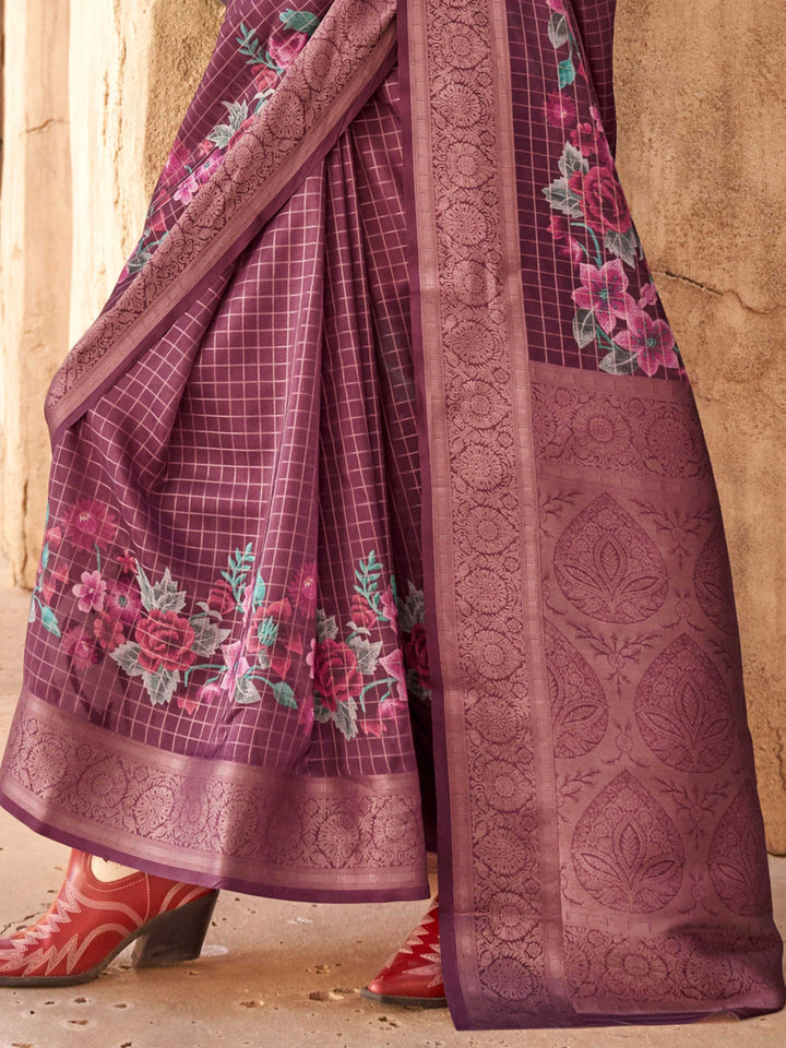 This Plum Purple–Dusty Rose FeatherSoft saree features stunning printed floral work with floral detailing and grid textures, ideal for festive evenings and cocktail-ready styling. Designed for lightweight elegance and statement draping. SKU 376001. This Plum Purple–Dusty Rose FeatherSoft saree features stunning printed floral work with floral detailing and grid textures, ideal for festive evenings and cocktail-ready styling. Designed for lightweight elegance and statement draping. SKU 376001.