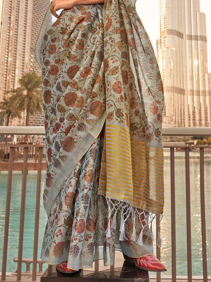 Powder Blue and Ivory zari tissue saree with printed floral motifs and zari pallu This image captures the back drape focus revealing pallu finesse and motif richness, ideal for visualizing festive elegance, designer appeal, and modern styling inspiration. Perfect for online shoppers seeking detailed previews before purchase, enhancing saree visual merchandising and SEO-rich product display strategy.