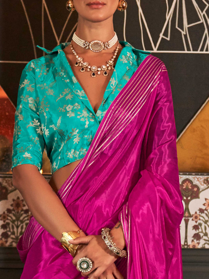 The main body of the saree has a fluid, breathable drape while the borders are defined with minimalist zari striping