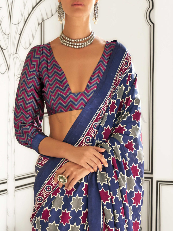 Navy Blue and Red-Ivory satin crepe saree with ajrakh digital print, soft texture and festive drape This image captures the zoomed texture view illustrating fabric weave and print clarity, ideal for visualizing festive elegance, designer appeal, and modern styling inspiration. Perfect for online shoppers seeking detailed previews before purchase, enhancing saree visual merchandising and SEO-rich product display strategy.