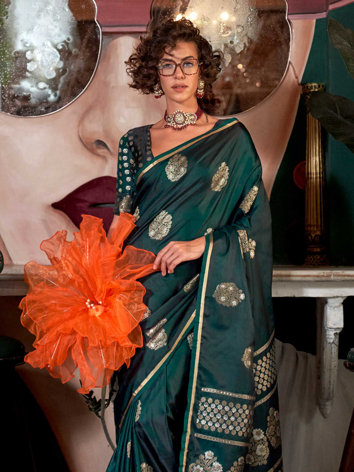 Rich zari motif silk saree in handloom satin fabric, styled with ethnic blouse – elegant ethnic wear This image captures the side angle view showcasing blouse styling and zari border detail, ideal for visualizing festive elegance, designer appeal, and modern styling inspiration. Perfect for online shoppers seeking detailed previews before purchase, enhancing saree visual merchandising and SEO-rich product display strategy.